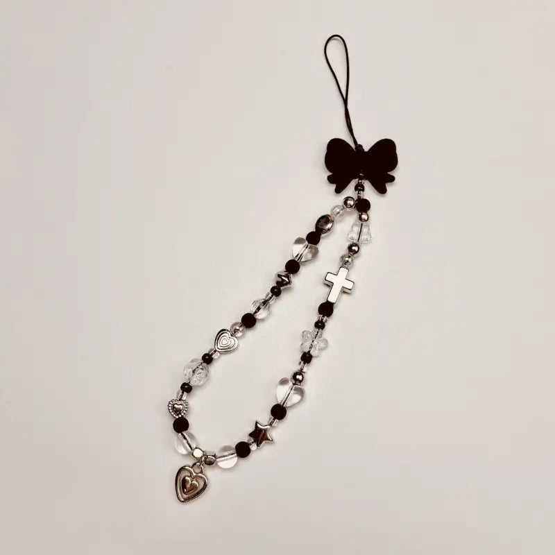 Handmade Pendant] Stylish Handmade Black Heart Pendant Phone Lanyard | Durable Plastic Material, Unique Handmade Touch, Camera Charm Strap, Cross Charm & BeadedDesign